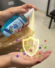Hand holding a bottle of hand sanitizer with a shield and virus graphics on a neutral background